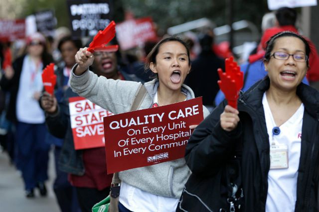 Nurses and their supporters protest in front of New York-Presbyterian Hospital in April of 2015